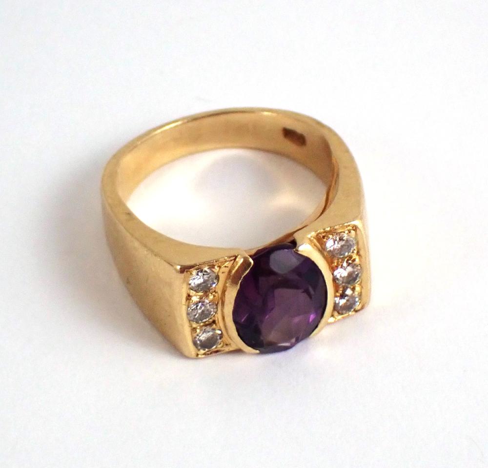 Appraisal: AMETHYST DIAMOND AND FOURTEEN KARAT GOLD RING with three round-cut