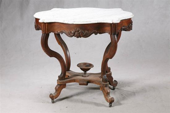 Appraisal: MARBLE TOP TABLE Walnut with carved floral decoration and a