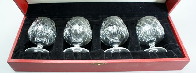 Appraisal: A boxed set of four Cartier diamond cut brandy balloons