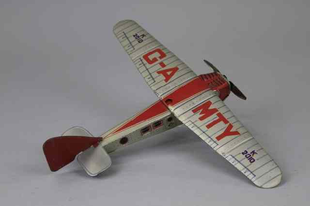 Appraisal: MONOPLANE Mettoy England lithographed tin done in silver and red