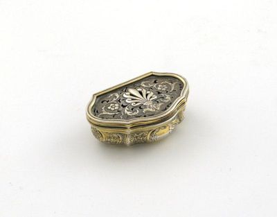 Appraisal: A modern silvergilt vinaigrette cartouche shaped embossed around the body