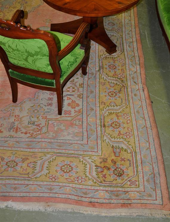 Appraisal: USHAK antique Pink ground with a yellow central medallion and