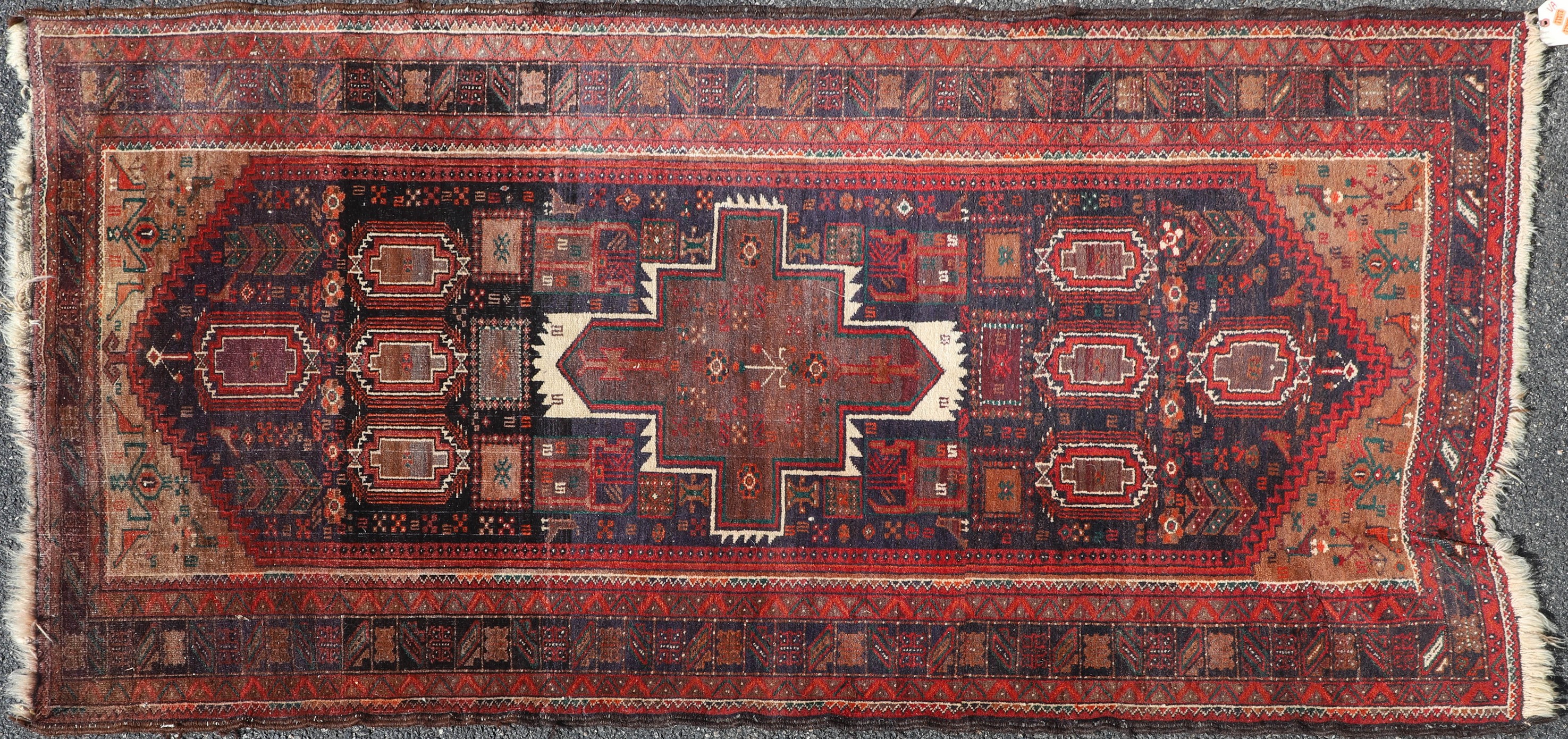 Appraisal: ' X ' Semi Antique Persian Baluch Rug distorted shape