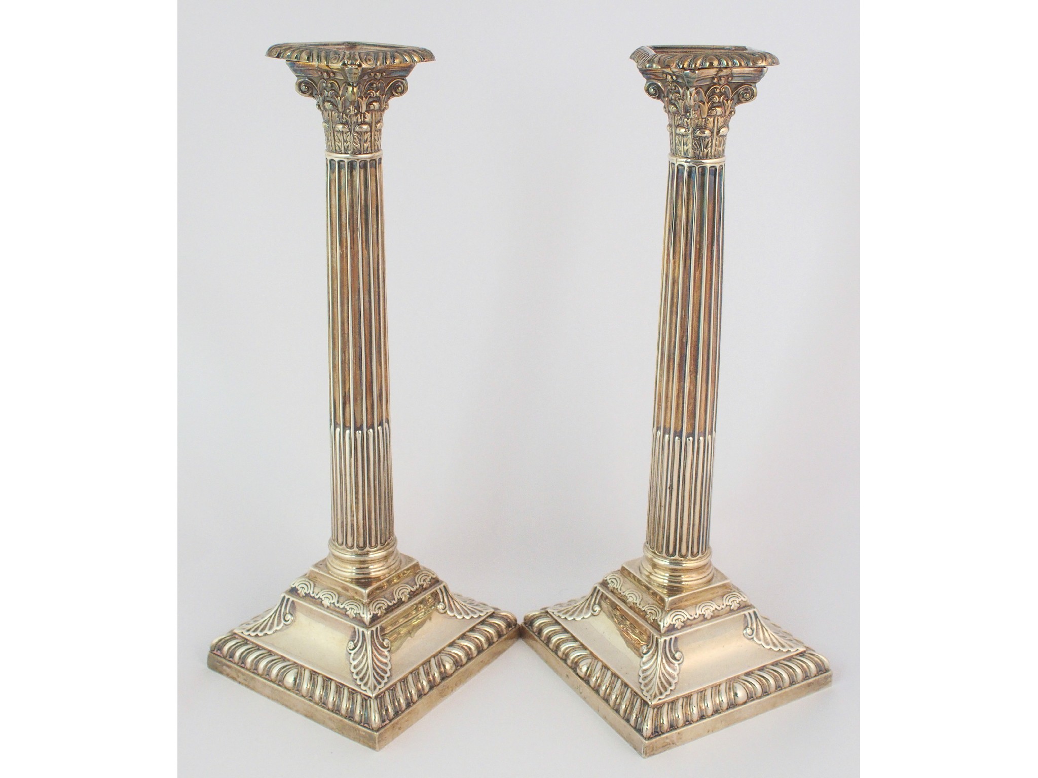 Appraisal: A pair of silver candlesticksby Henry Wilkinson Co rubbed London