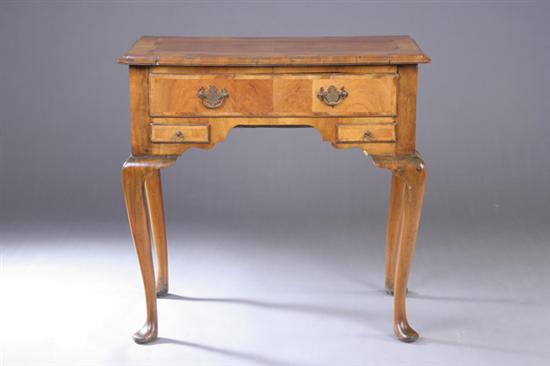 Appraisal: ENGLISH QUEEN ANNE WALNUT DRESSING TABLE th century Projecting molded-edge