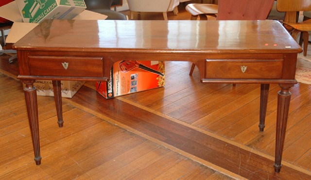 Appraisal: A TH CENTURY FRENCH MAHOGANY DESK The rounded rectangular top