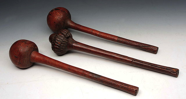 Appraisal: A GROUP OF THREE POLYNESIAN WOODEN CLUBS two of nut