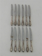 Appraisal: A set of German silver-handled cheese knives with stainless steel