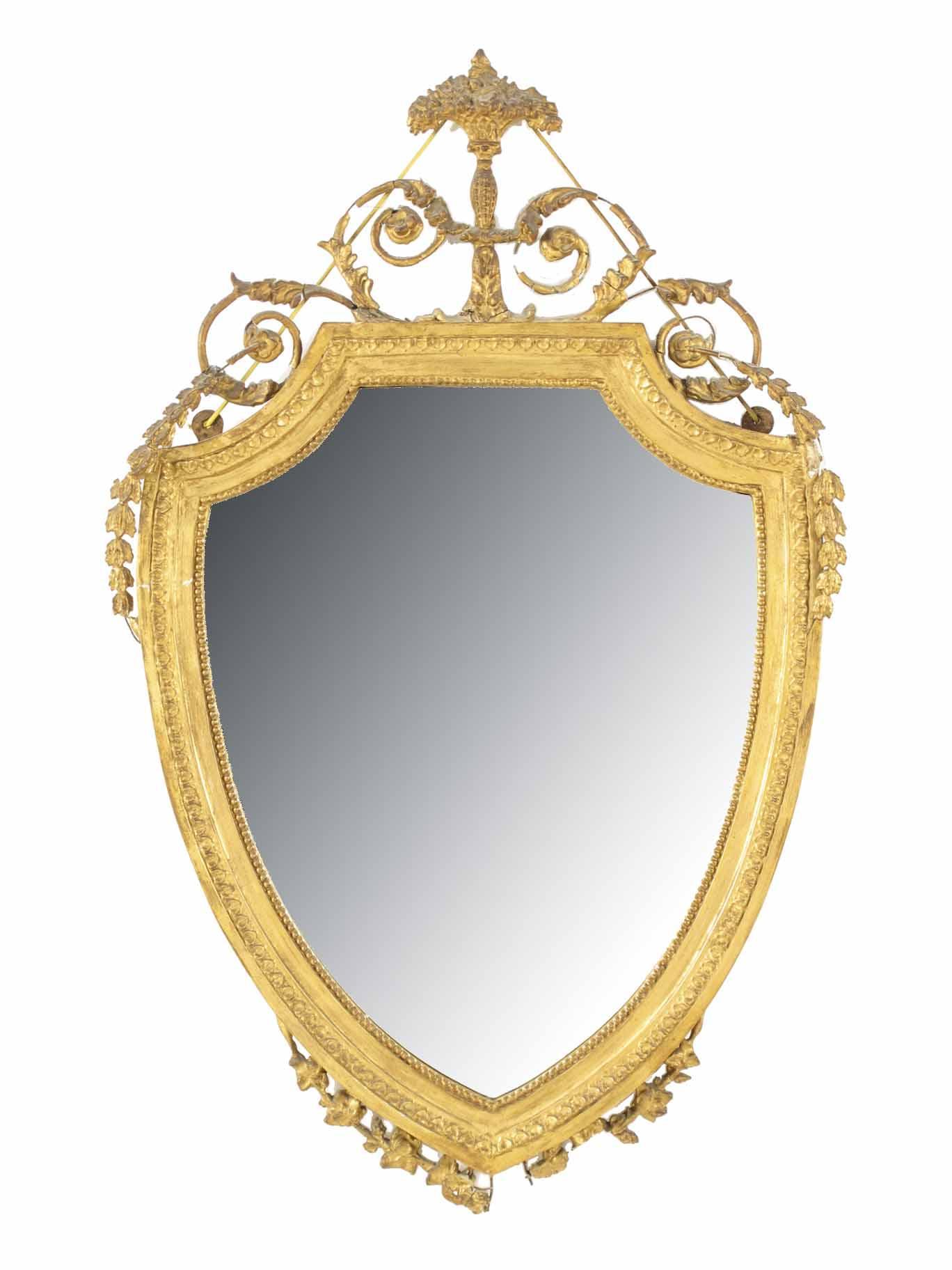 Appraisal: An Edwardian gilt and gesso shield shape wall mirror