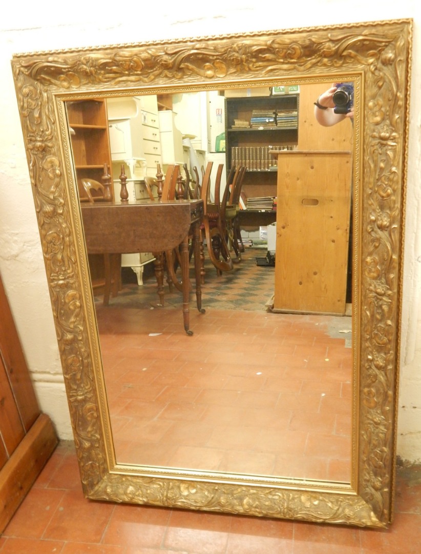 Appraisal: Two modern rectangular gilt gesso wall mirrors the smallest cm