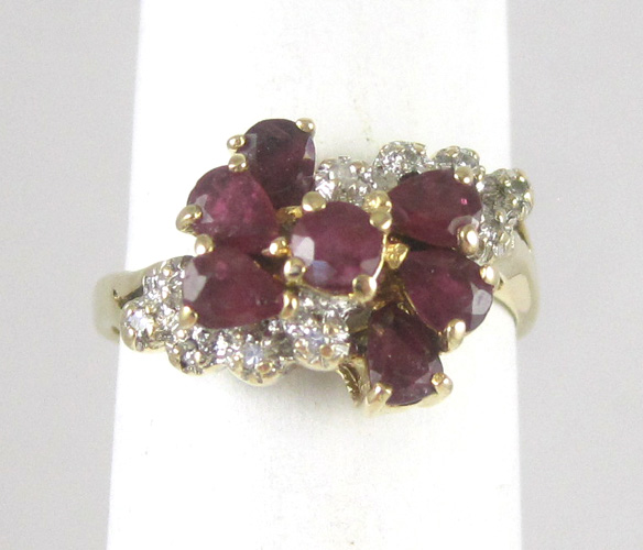 Appraisal: RUBY DIAMOND AND FOURTEEN KARAT GOLD RING with six pear-cur