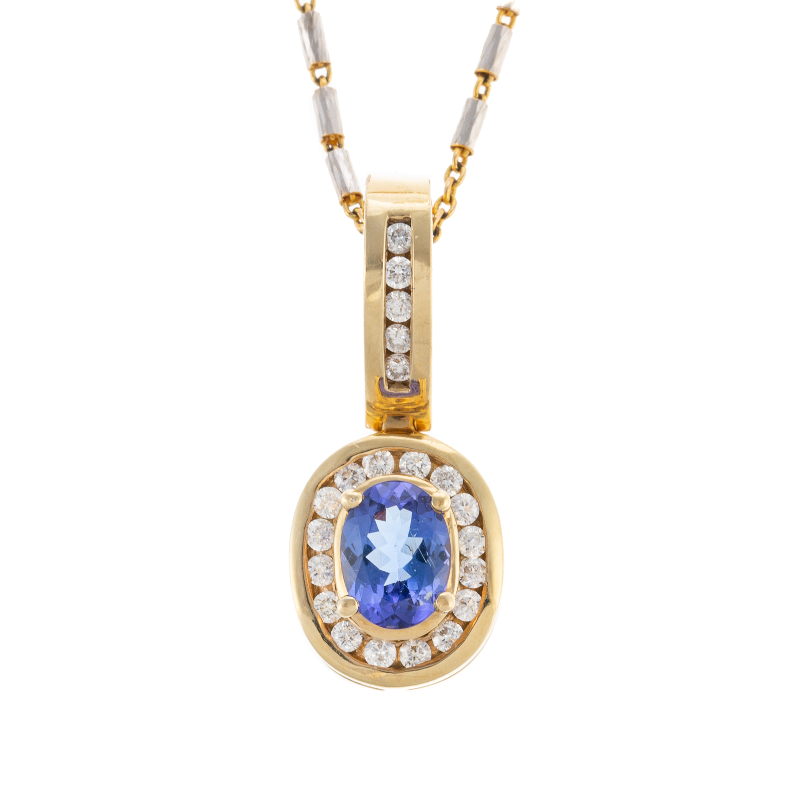 Appraisal: A TANZANITE DIAMOND PENDANT IN GOLD K yellow gold pendant