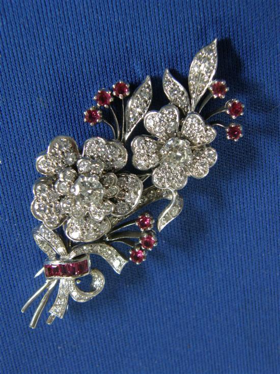 Appraisal: Diamond and ruby foliate spray brooch with two principal diamonds