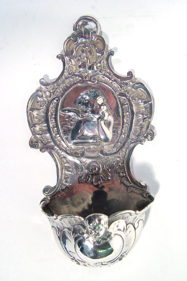 Appraisal: Embossed silver hanging wall pocket embossed with a cherub and