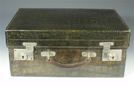 Appraisal: An early th century green leather faux-crocodile gentleman's travelling case