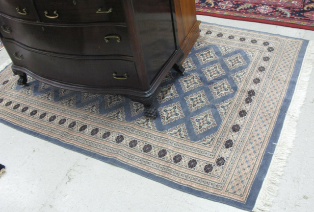 Appraisal: BOKHARA AREA RUG repeating diamond-shaped gols across a blue-gray field