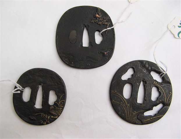 Appraisal: THREE JAPANESE TSUBA SAMURAI SWORD GUARDS of bronze and cast