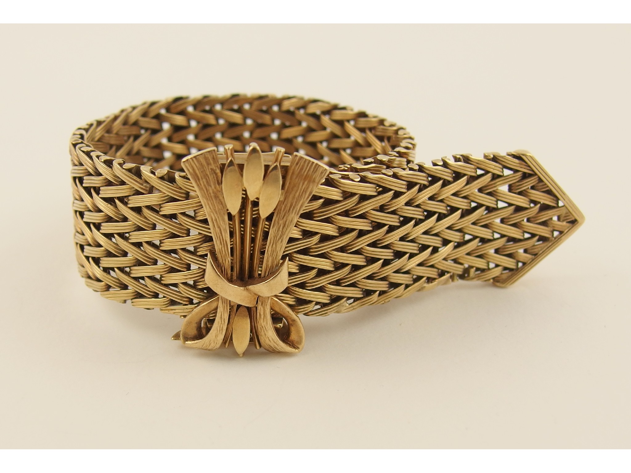 Appraisal: A ct heavy woven braceletwith decorative clasp designed as bulrushes