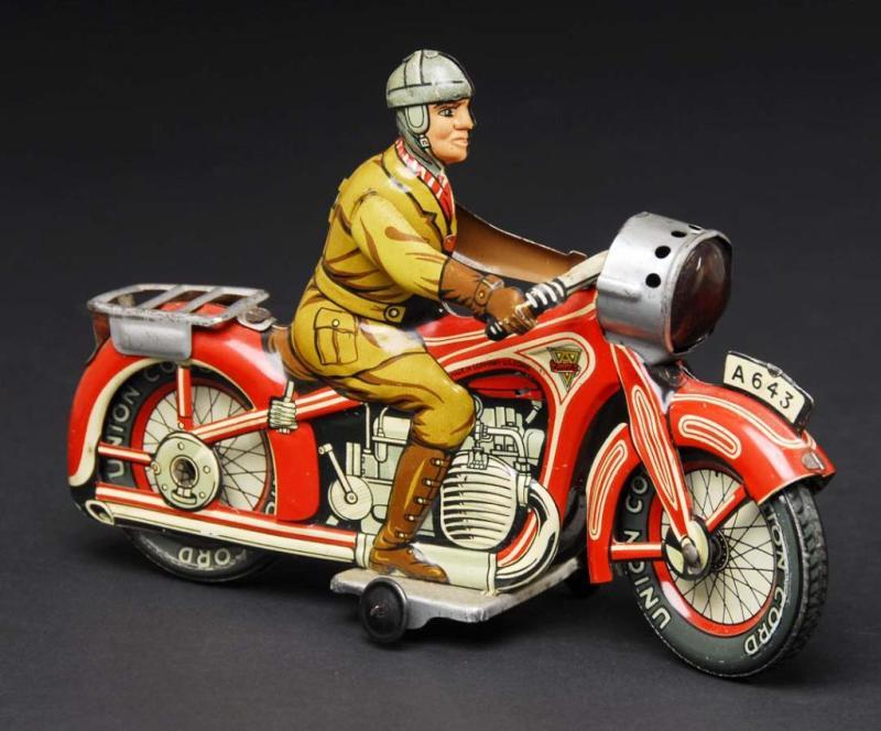 Appraisal: Tin Arnold Motorcycle Wind-Up Toy Description German Working Marked Made