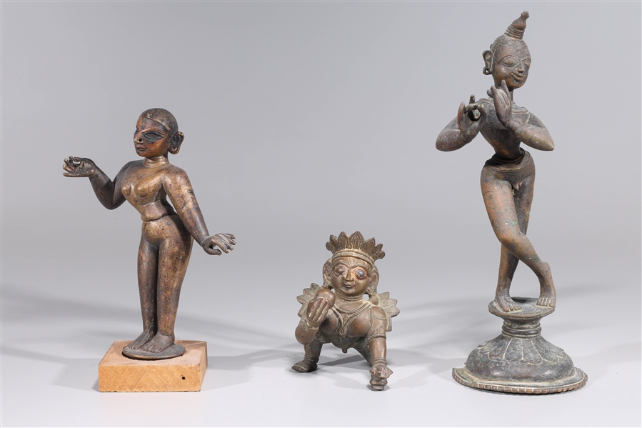 Appraisal: Three bronze cast statues of Krishna Radha and Bala Krishna