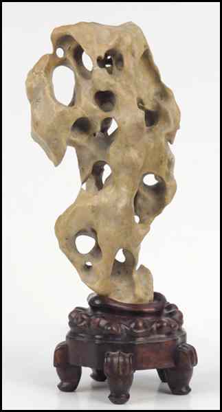 Appraisal: CARVED SOAPSTONE SCHOLAR'S ROCK Raised on a '' base Carving