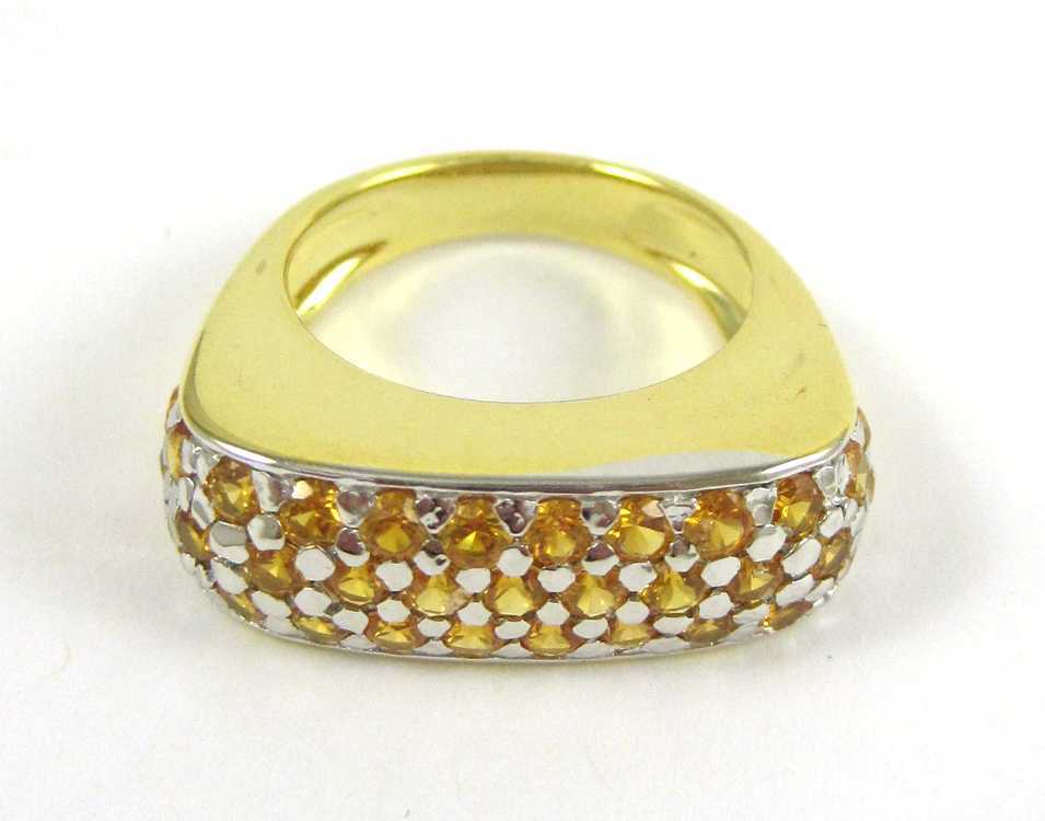 Appraisal: ORANGE SAPPHIRE AND FOURTEEN KARAT GOLD RING The heavy yellow