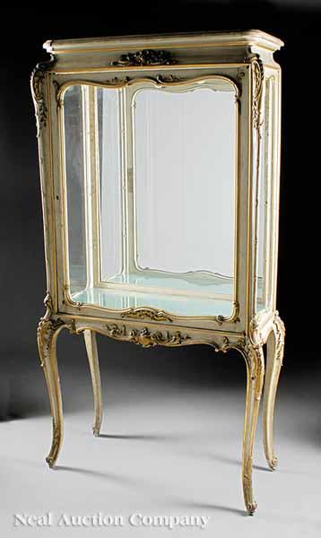 Appraisal: An Antique Rococo-Style Parcel Gilt Vitrine waisted frieze over glazed