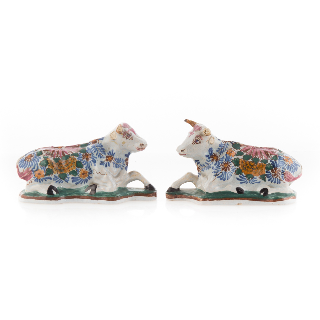 Appraisal: Pair Dutch polychrome Delftware cows late th century recumbent cows