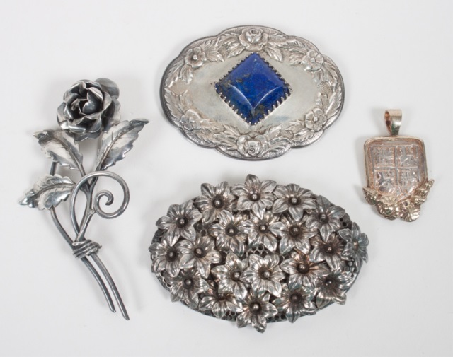 Appraisal: Three silver brooches and a silver coin pendant the brooches