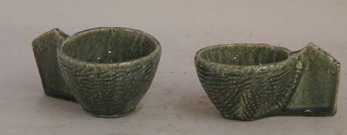 Appraisal: Two green teacups Two Judaic Sculptures with Menorah Ceramic on