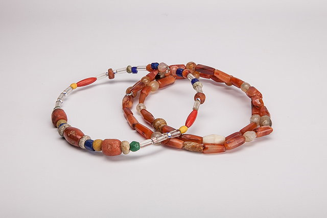 Appraisal: TWO ROWS OF CORNELIAN AGATE AND CRYSTAL BEADS longest length