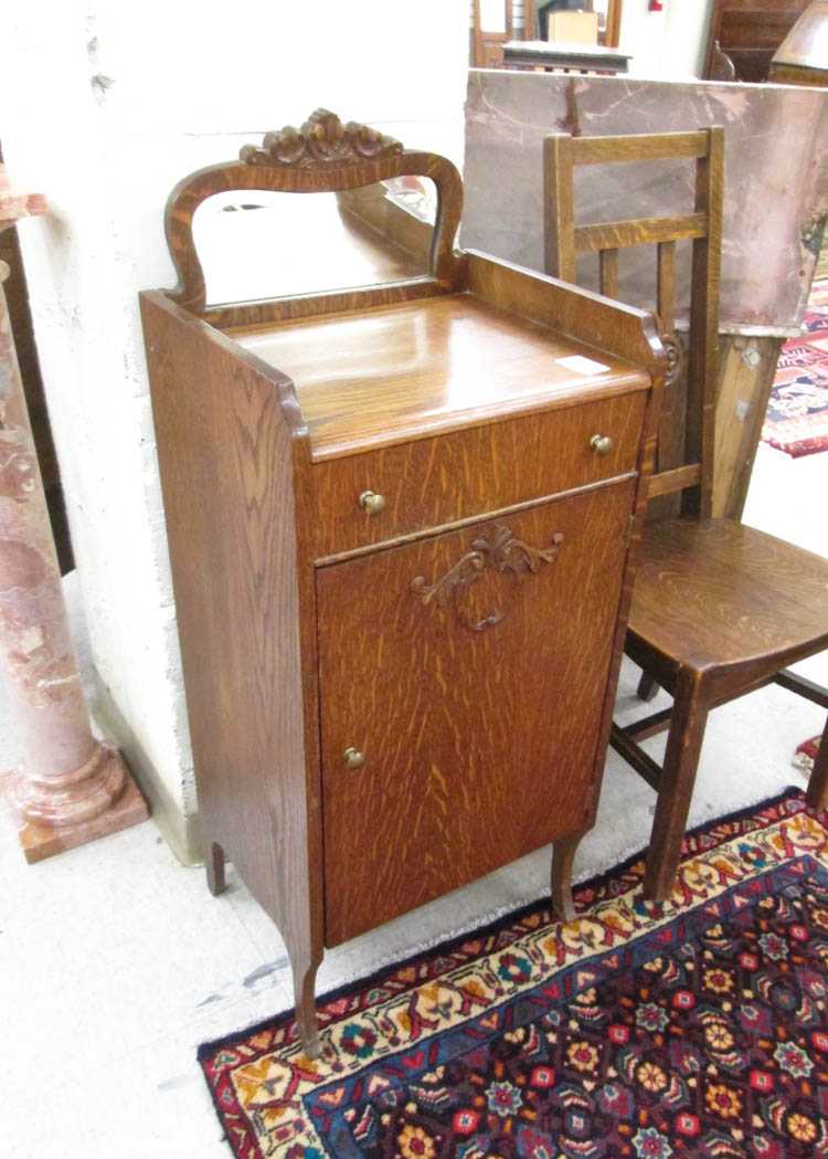 Appraisal: AN OAK MUSIC CABINET AND SIDE CHAIR American c the