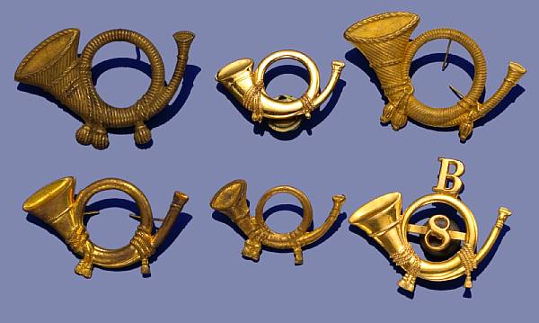 Appraisal: A lot of six Infantry hunting horn insignia Comprising Gilt