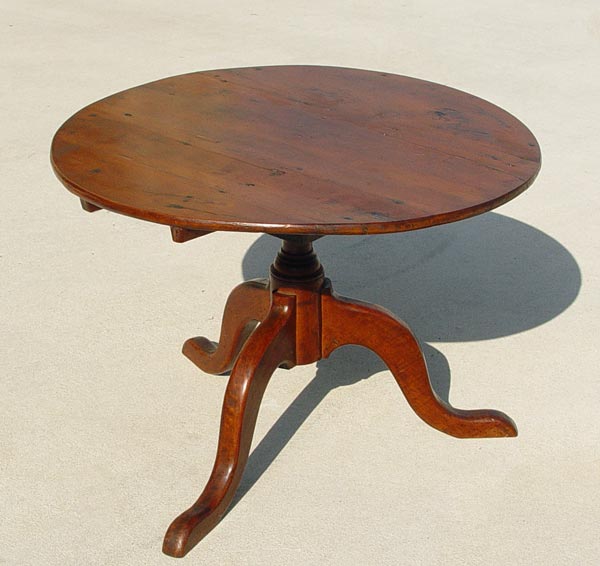 Appraisal: CHERRY TILT TOP LOW TABLE ON BIRD CAGE BASE Measures