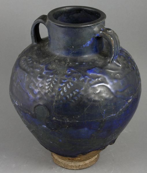 Appraisal: th th Century partially cobalt glazed two-handled jar with relief