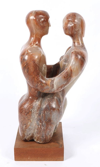 Appraisal: AN ALABASTER SCULPTURE representing a conjoined male and female figure