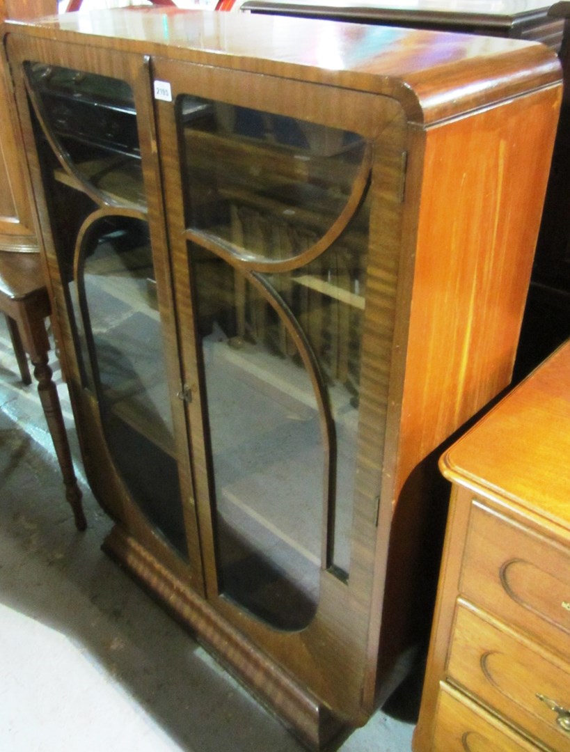 Appraisal: An early th century mahogany two door display cabinet