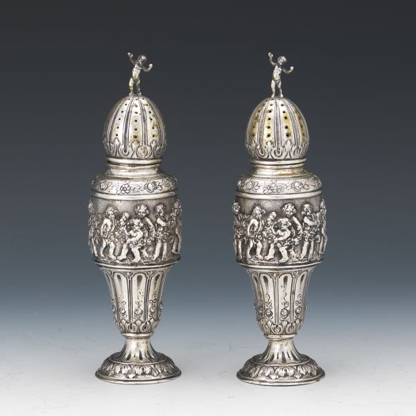 Appraisal: PAIR OF GERMAN SILVER BAROQUE STYLE SALT PEPPER PUTTI MASTER