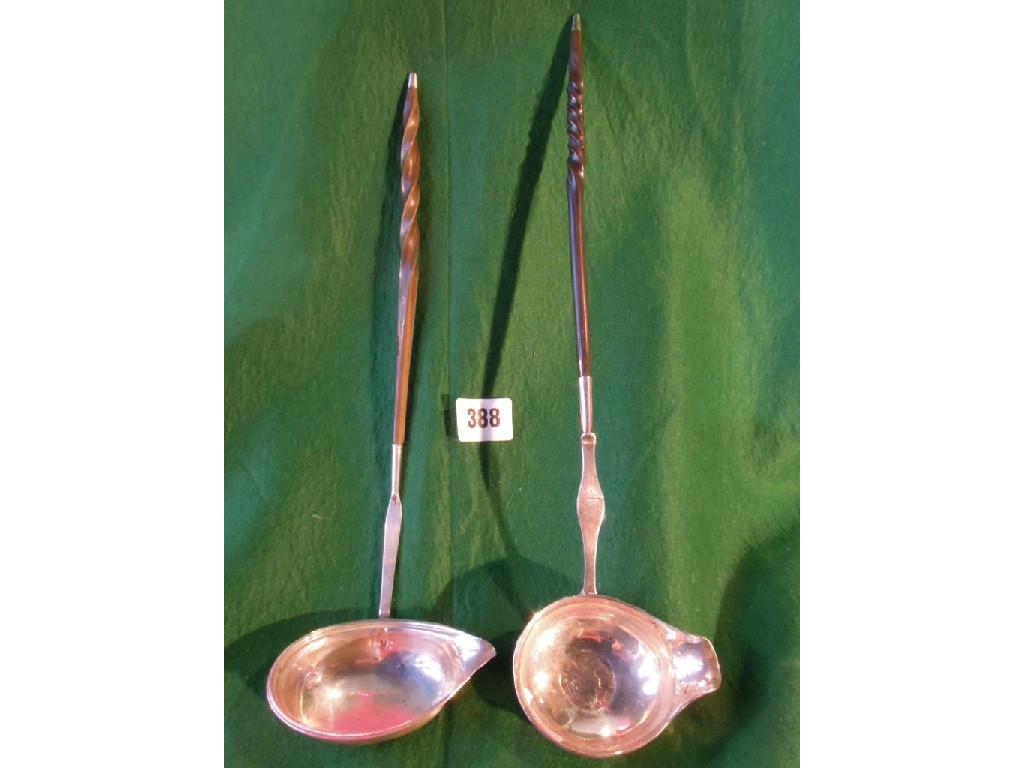 Appraisal: Two Georgian silver toddy ladles one with impressed coin both