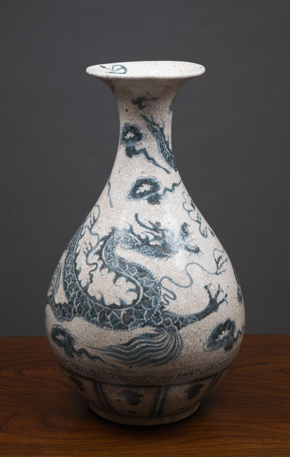 Appraisal: CHINESE BLUE AND WHITE DRAGON VASE Ming style of pear