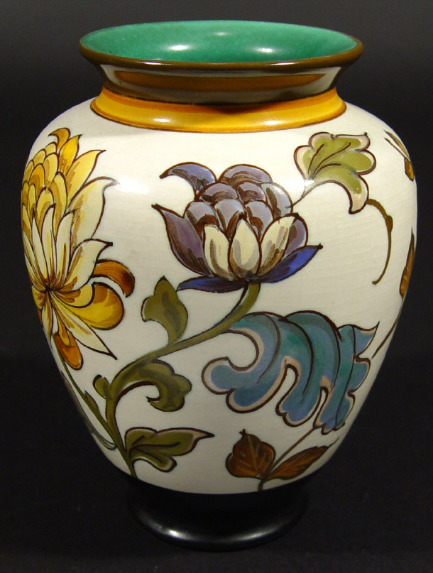 Appraisal: Gouda pottery baluster vase hand painted with chrysanthemums onto a