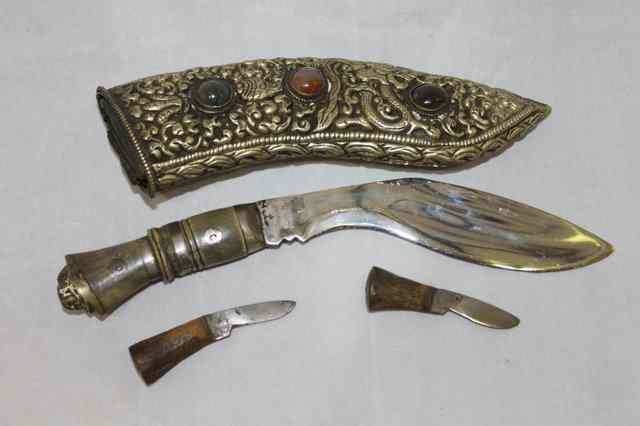 Appraisal: A BUMESE KUKRI in a silver metal scabbard with hardstone