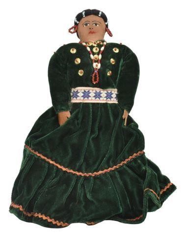 Appraisal: Native American doll a green velour dress with beaded earrings