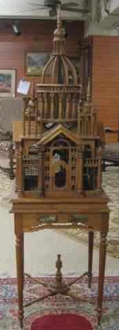 Appraisal: ARCHITECTURAL BIRDCAGE ON STAND American Aesthetic Movement influence the mahogany