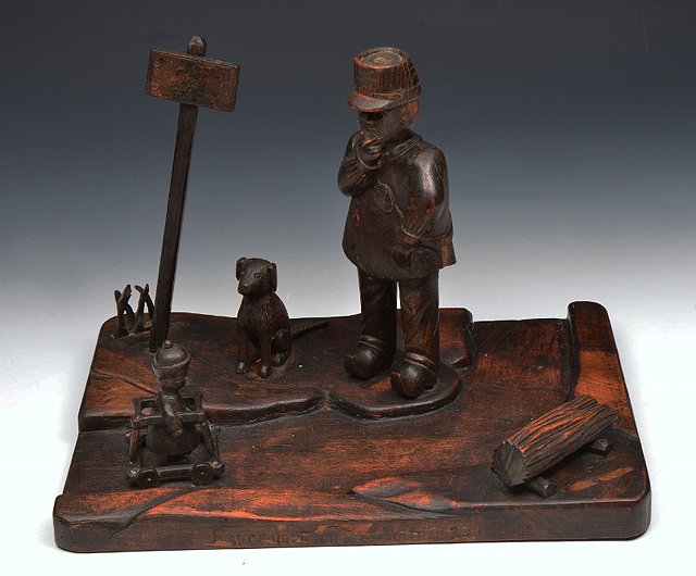 Appraisal: A FRENCH FOLK ART CARVED MODEL 'Est-ce un Pieton ou