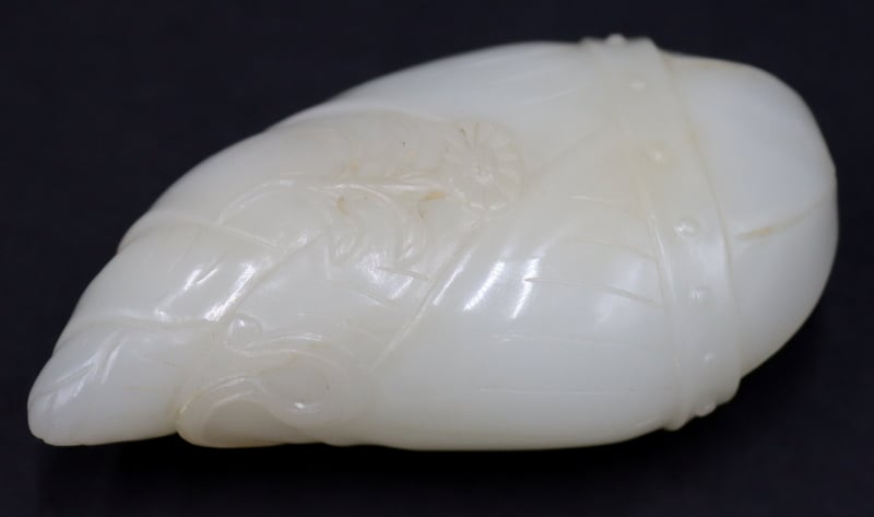 Appraisal: CHINESE CARVED WHITE JADE SNUFF BOTTLE With floral decoration and