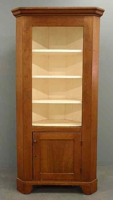 Appraisal: Pine corner cupboard early th c with a molded cornice