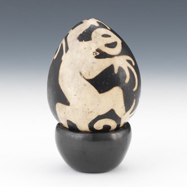 Appraisal: NATIVE AMERICAN POTTERY EGG WITH LIZARDS ON BLACKWARE POTTERY STAND