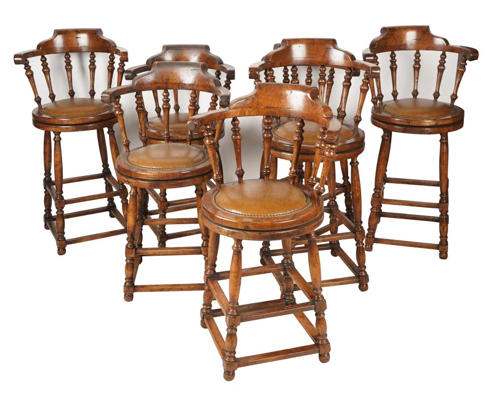 Appraisal: SET OF SEVEN WALNUT SWIVEL BARSTOOLSmanufacturer unknown each with brown