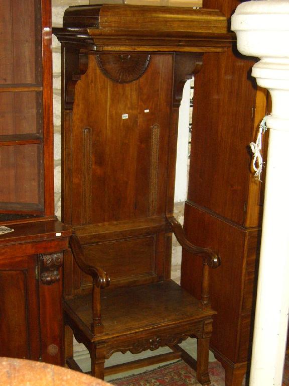 Appraisal: A Victorian walnut hall porters chair with stylised canopy shaped